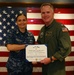 Senior Chief Natalie Jianuzzi accepts an end of tour award