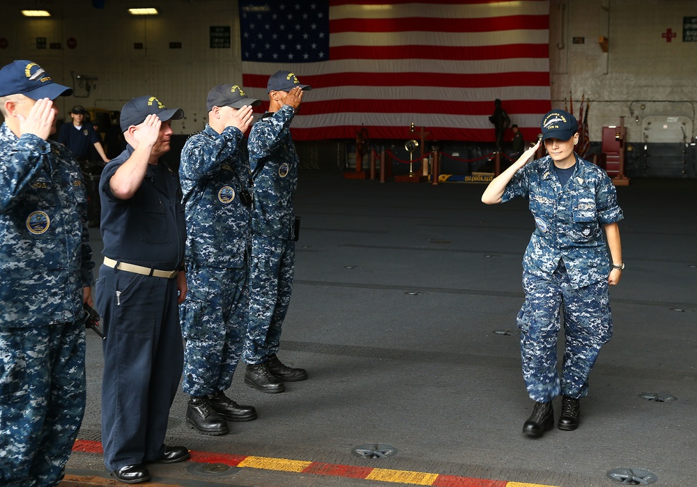 Senior Chief Hospital Corpsman Natalie Jianuzzi gets piped ashore