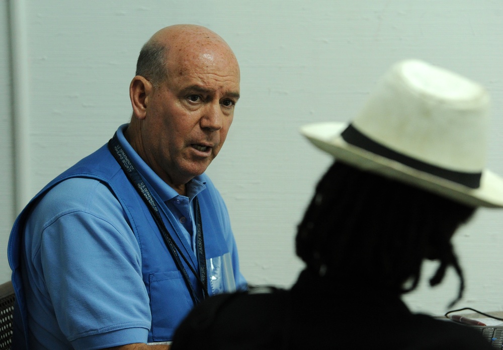 A Disaster Survivor Assistance Specialist Helps Register a Local Resident for Disaster Assistance