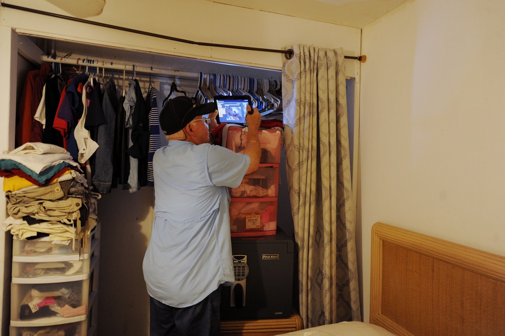 A FEMA Housing Inspector Does a Damage Assessment at a Renter's Apartment