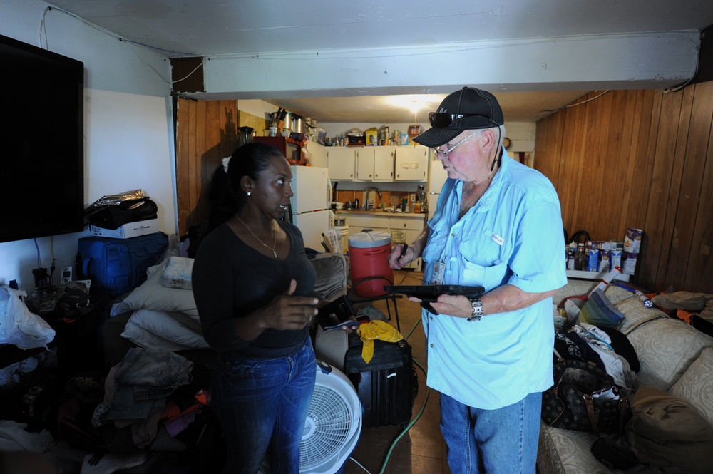 A FEMA Housing Inspector Does a Damage Assessment at a Renter's Apartment