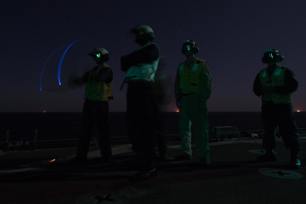 USS Pearl Harbor flight deck personnel launch and recover Army helicopters