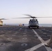 USS Pearl Harbor flight deck personnel launch and recover Army helicopters