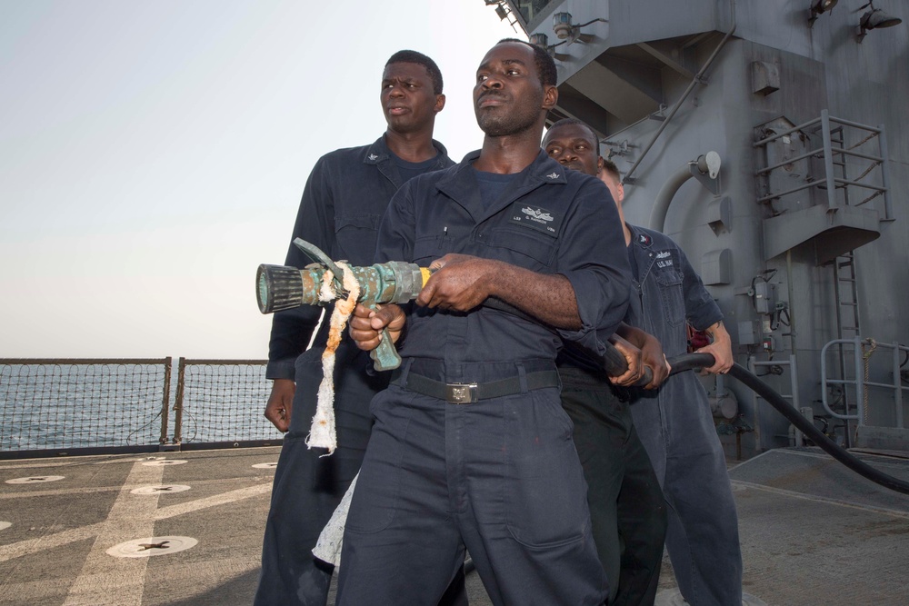 USS Pearl Harbor flight deck personnel launch and recover Army helicopters