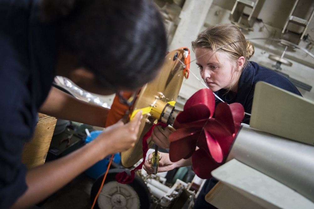 USS Chafee Sailors Connect Air Stabilizer to Torpedo