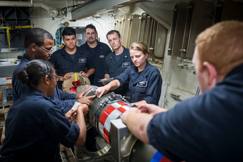 USS Chafee Sailors Connect Air Stabilizer to Torpedo