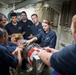 USS Chafee Sailors Connect Air Stabilizer to Torpedo