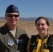 Col. Eric Wade, 152nd Airlift Wing Commander and Airman Baylee Hunt stop for a photo after Hunt's tandem jump