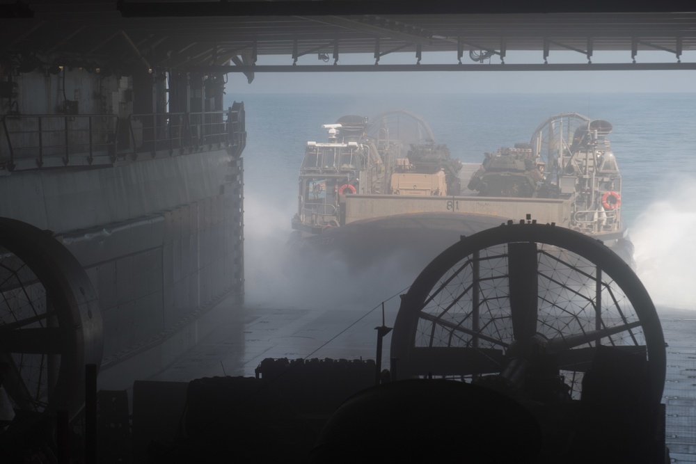 USS Pearl Harbor flight deck personnel launch and recover Army helicopters