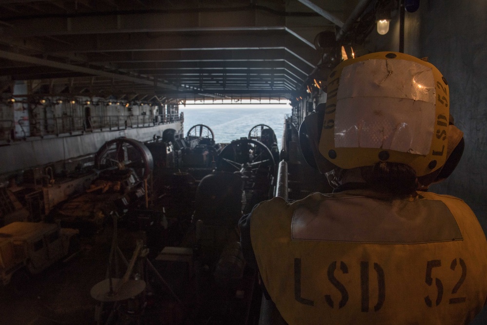 USS Pearl Harbor flight deck personnel launch and recover Army helicopters