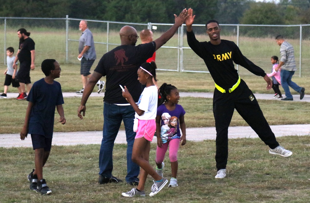 207th Signal soldiers help children’s physical training