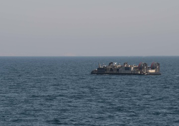 USS Pearl Harbor flight deck personnel launch and recover Army helicopters