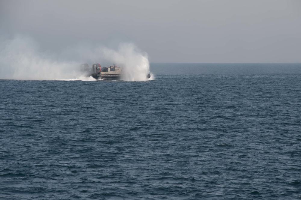 USS Pearl Harbor flight deck personnel launch and recover Army helicopters