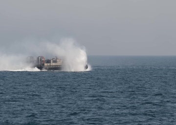 USS Pearl Harbor flight deck personnel launch and recover Army helicopters