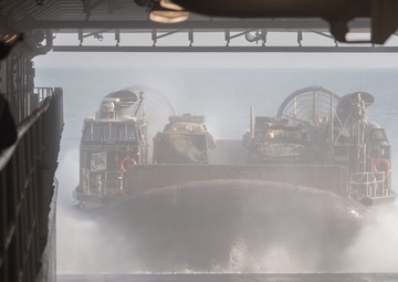 USS Pearl Harbor flight deck personnel launch and recover Army helicopters