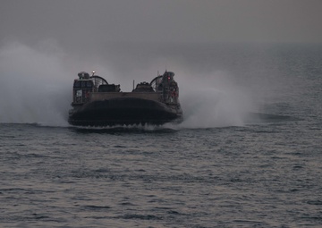 USS Pearl Harbor flight deck personnel launch and recover Army helicopters
