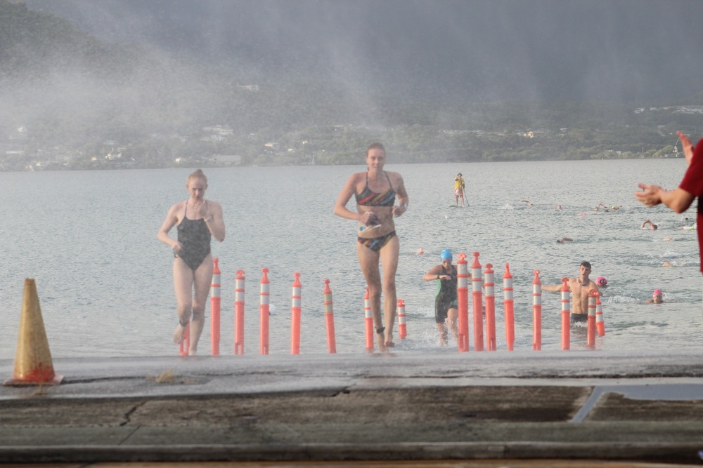 Service members and their families participate in Splash and Dash Biathlon