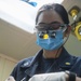 USS America Sailor conducts dental check-up