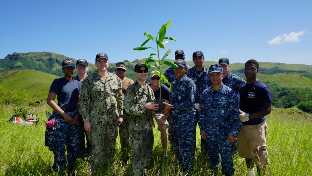 Sailors pose for a group photo at the Manell Watershed Restoration Project site