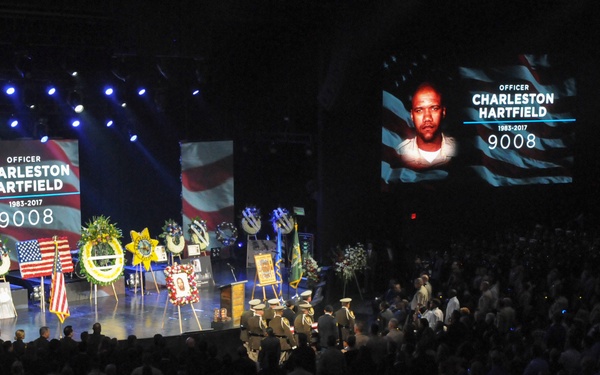 Honor guard lifts casket of fallen hero