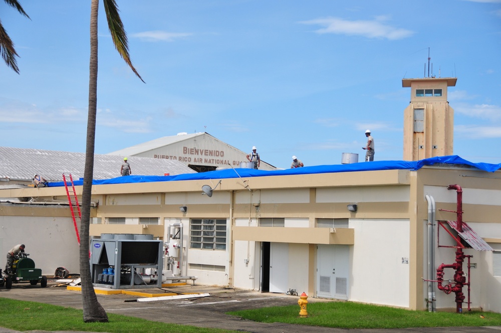 156th Civil Engineering Squadron repair roof with FEMA blue sheets