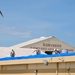 156th Civil Engineering Squadron repair roof with FEMA blue sheets