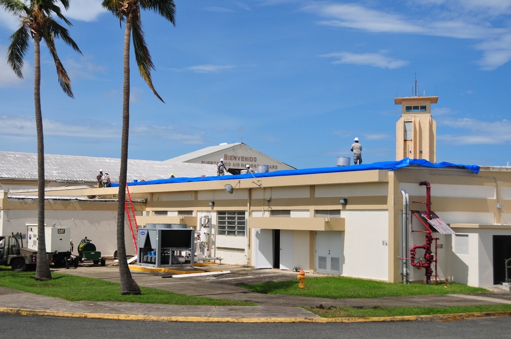 156th Civil Engineering Squadron repair roof with FEMA blue sheets