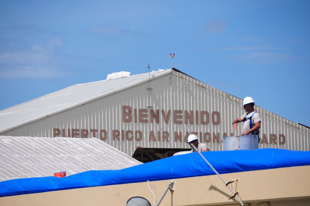 156th Civil Engineering Squadron repair roof with FEMA blue sheets