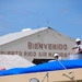 156th Civil Engineering Squadron repair roof with FEMA blue sheets