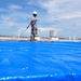 156th Civil Engineering Squadron repair roof with FEMA blue sheets