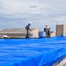 156th Civil Engineering Squadron repair roof with FEMA blue sheets