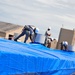 156th Civil Engineering Squadron repair roof with FEMA blue sheets