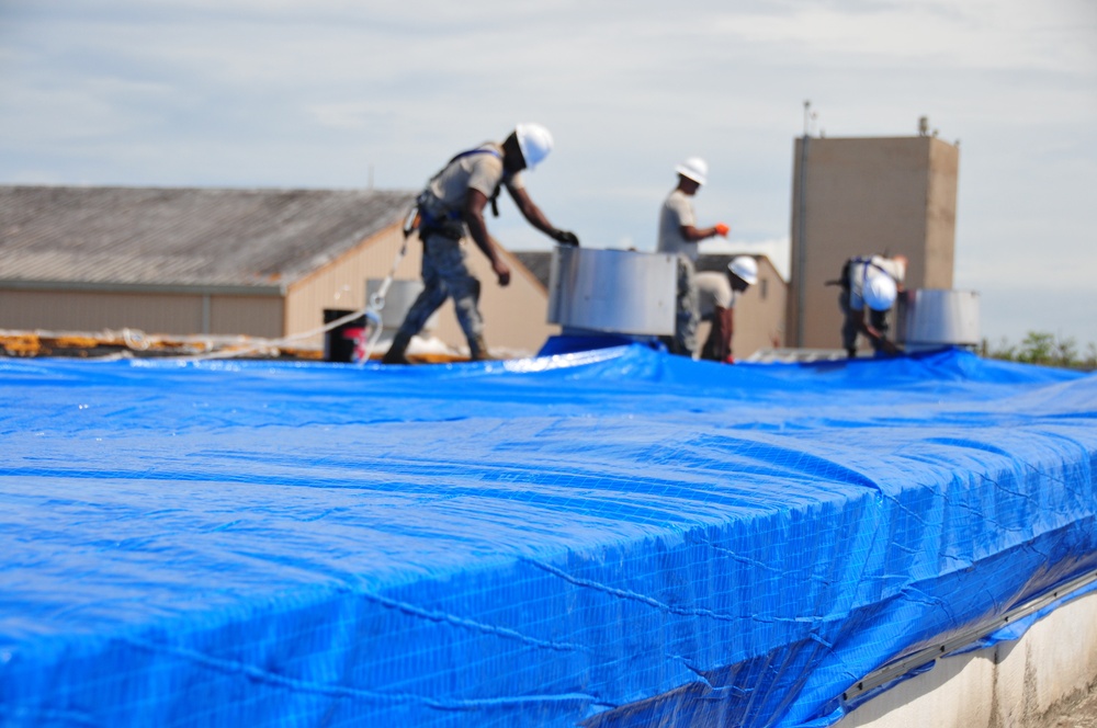 156th Civil Engineering Squadron repair roof with FEMA blue sheets