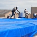 156th Civil Engineering Squadron repair roof with FEMA blue sheets