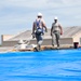 156th Civil Engineering Squadron repair roof with FEMA blue sheets