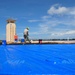 156th Civil Engineering Squadron repair roof with FEMA blue sheets