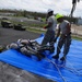 156th Civil Engineering Squadron repair roof with FEMA blue sheets