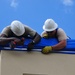 156th Civil Engineering Squadron repair roof with FEMA blue sheets