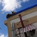 156th Civil Engineering Squadron repair roof with FEMA blue sheets