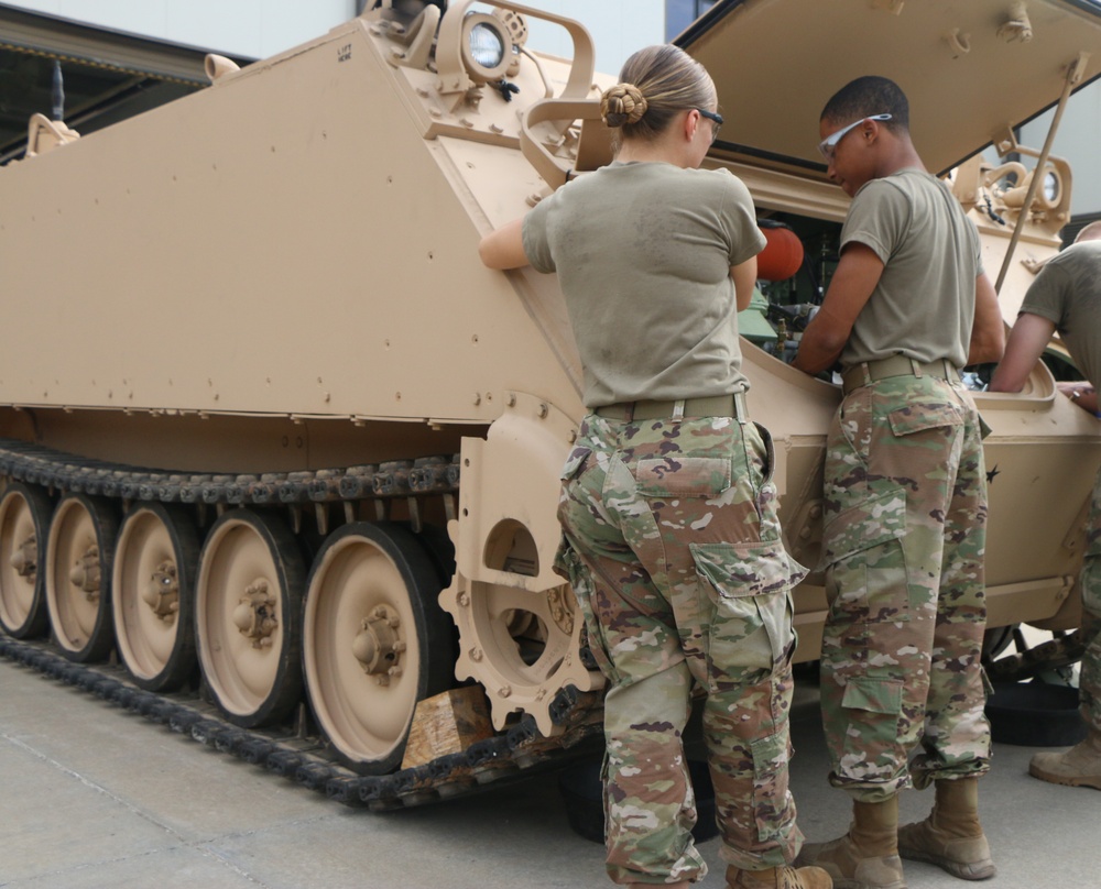 Soldiers train on maintaining the engine of an M113A3 armored personnel carrier 