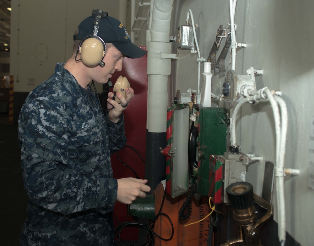Sailor Conducts Maintenance