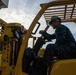 Sailor Operates Forklift