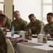 Lt. Gen. Michael Garrett meets junior officers during luncheon in Jordan