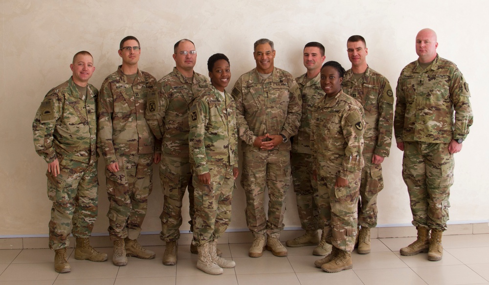 Lt. Gen. Michael Garrett meets junior officers during luncheon in Jordan