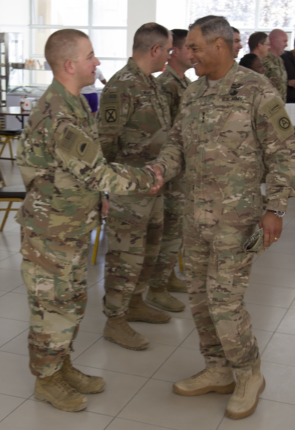 Lt. Gen. Michael Garrett meets junior officers during luncheon in Jordan