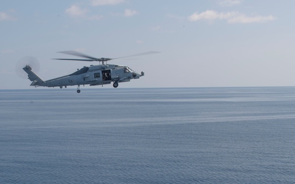 USS Lake Erie (CG 70) Sea Hawk flies above Gulf of Aden