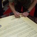 Brig. Gen. Rock signs Domestic Violence Awareness Month Proclamation aboard Camp Foster