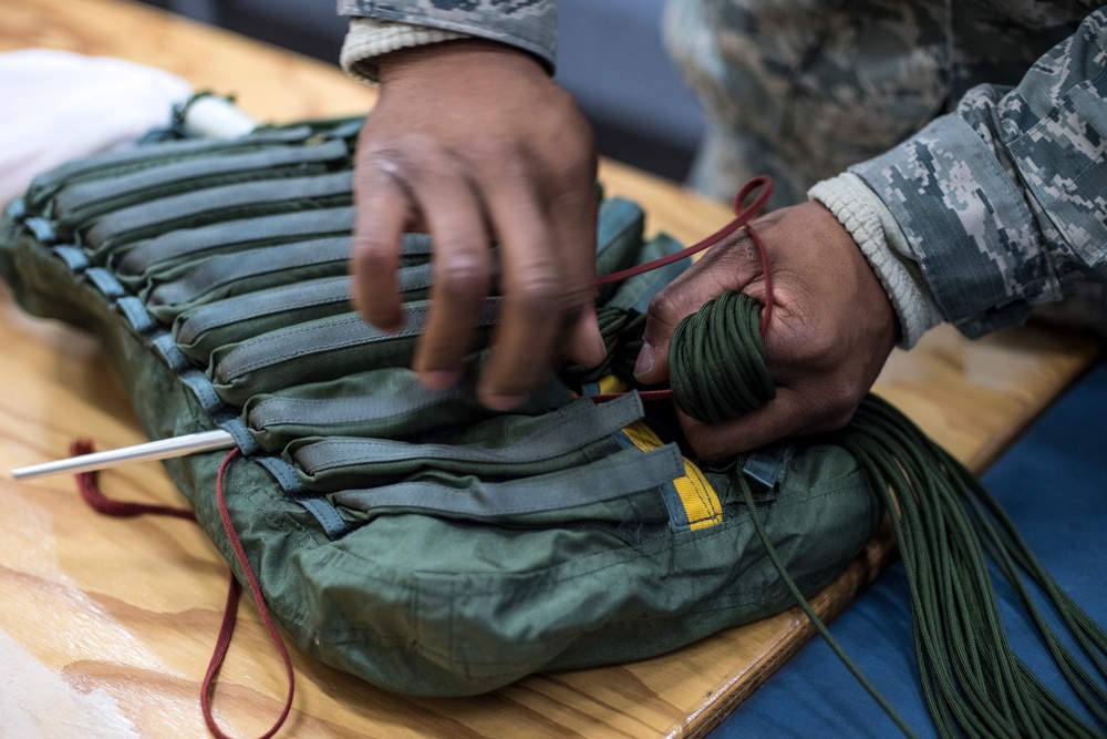 AFE preparing, packing parachutes