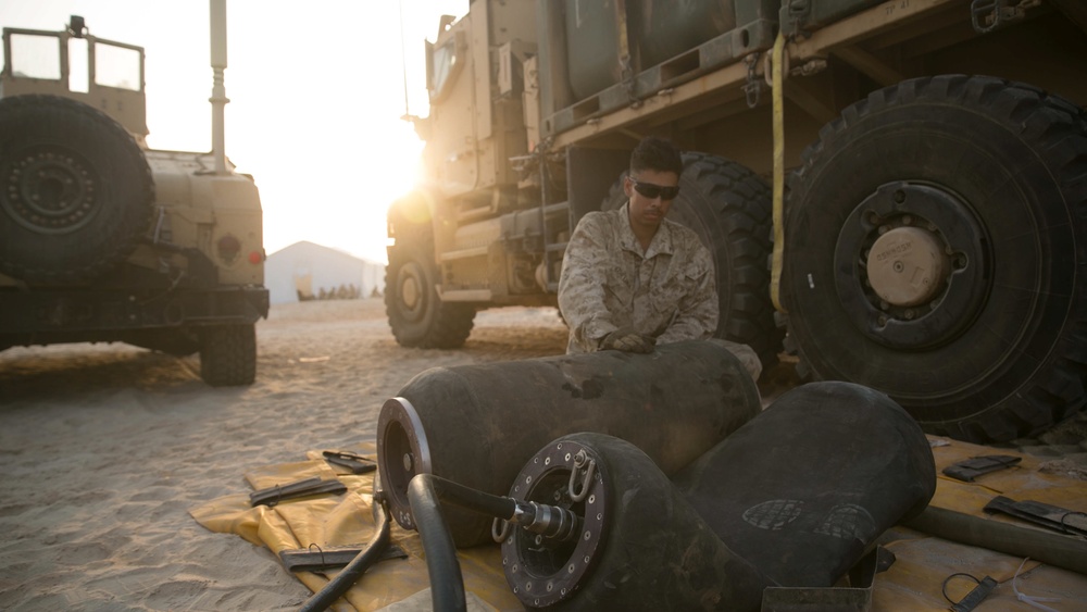 15th MEU LCE water dogs refill water bladders during Iron Magic 2018