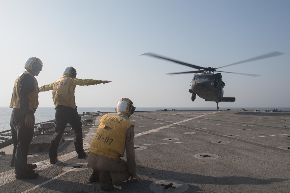UH-60 of UAE Joint Aviation Command performs DLQs on the flight deck of USS Pearl Harbor